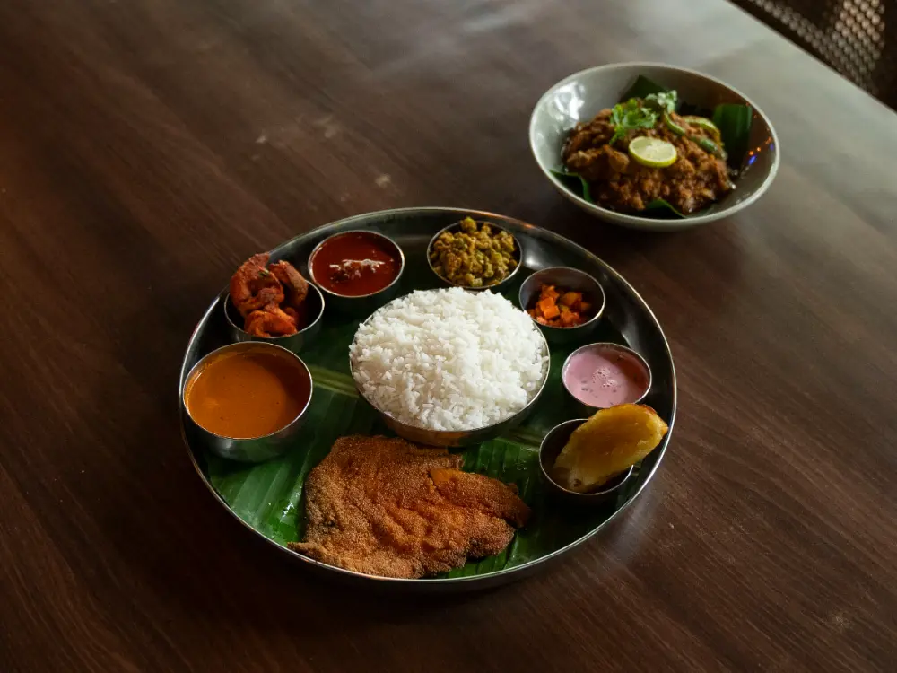 The non-vegetarian thali with pomfret fry, prawns, and chicken vindaloo