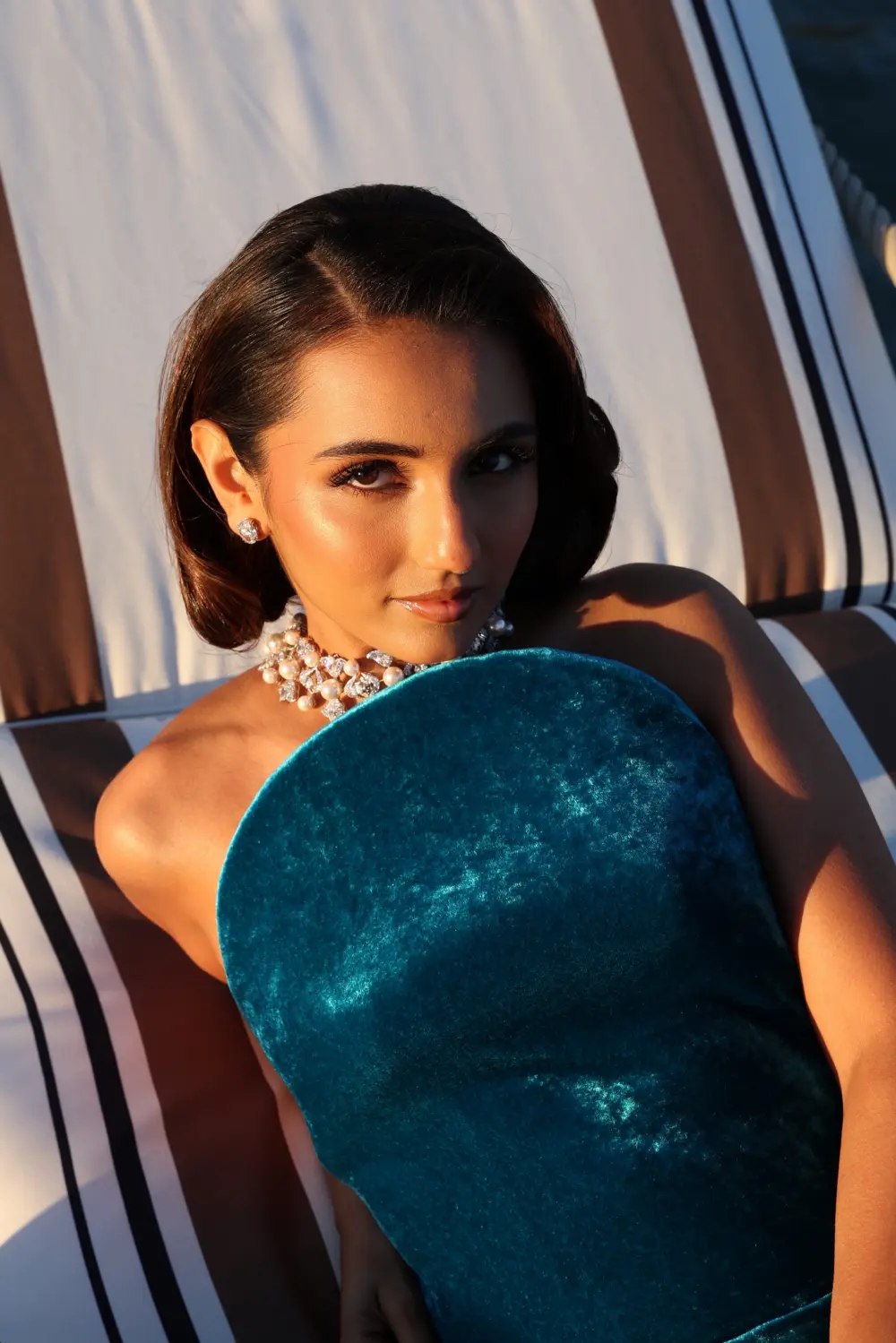 Masoom wears diamond earrings and a diamond choker