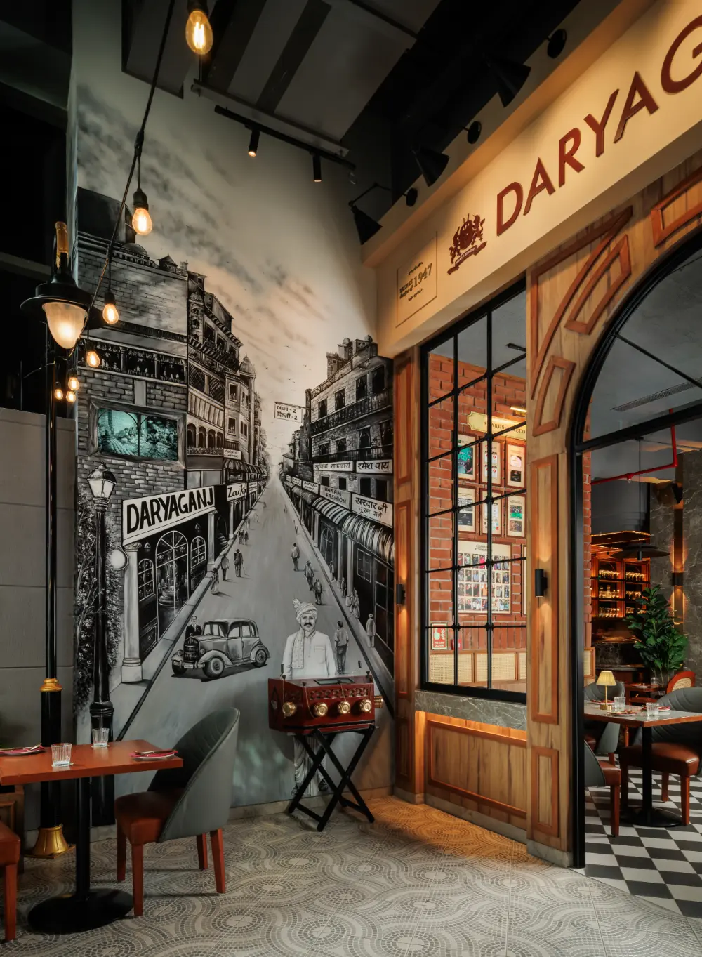 A graphic mural at the entrance, with embedded video and 3D vendor.