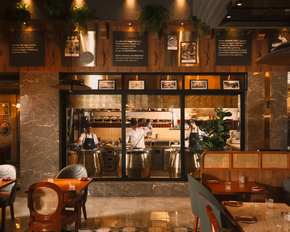 The open kitchen shows chefs at work