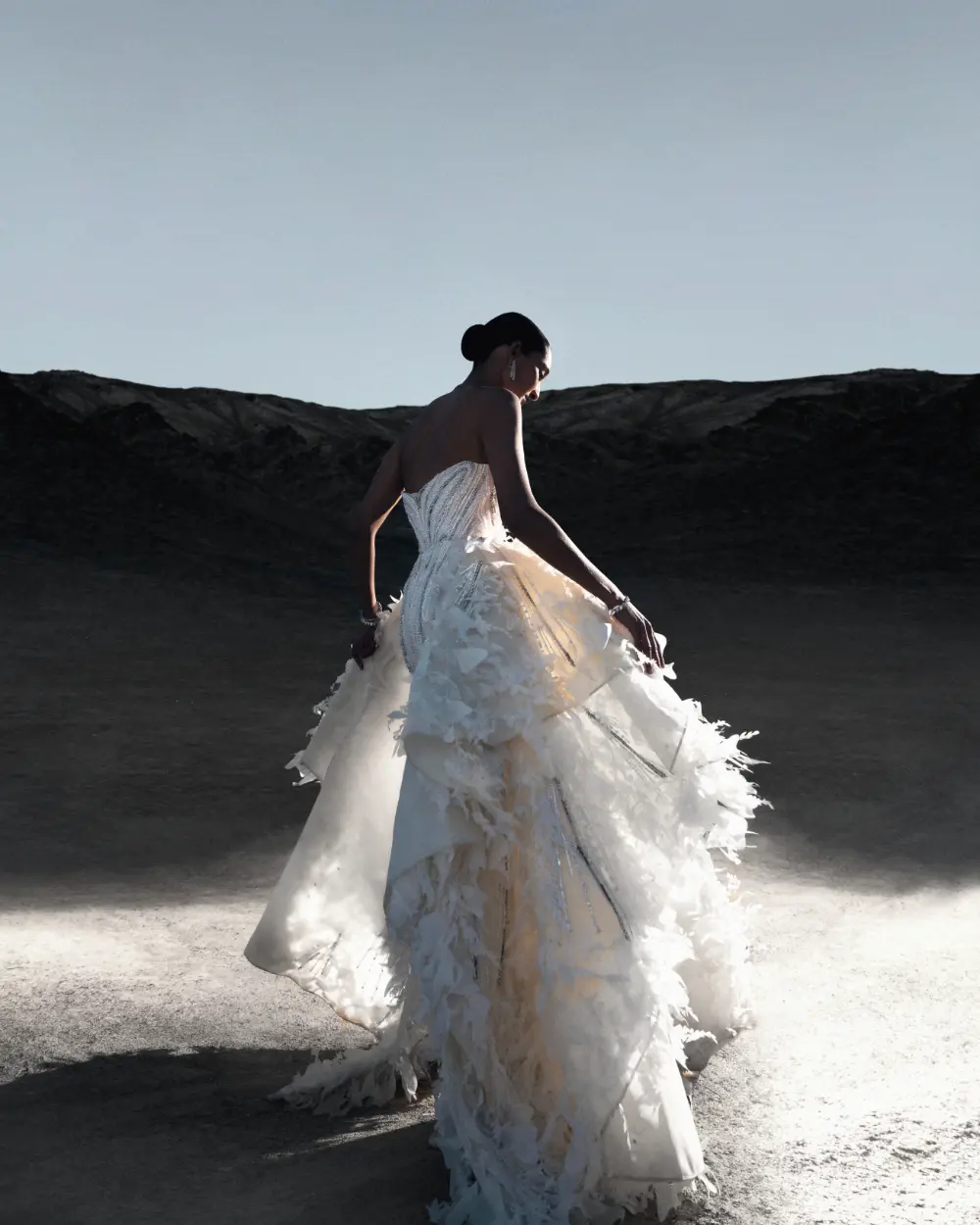 Dayena wears the Ivory Whisper gown with petal-like bodice embellished with pearls